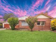 1940s Double Brick Home Filled with Character and Potential