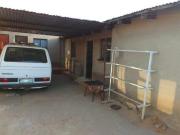 2 bedroom house with 5 outside rooms.