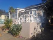 3 bedroom 2 bathroom home with a cot.