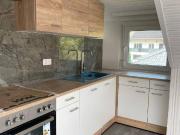 3 Zimmer Dachgeschosswohnung mit Carport und Garten in...