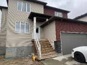 5703 Glide Cres. Home With Basement Suite