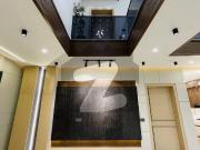 7 marla double heighted + rooftop sitting designer brand...