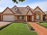 A Bespoke Tudor Masterpiece with Poolside Luxury and...