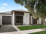 A Brand New Contemporary Home in a Coveted Coastal Pocket