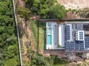 A casa dos seus sonhos no condomínio Campos de Santo...