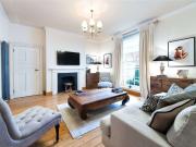 A charming terraced house providing spacious and...