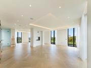 A contemporary duplex penthouse apartment in a luxury...