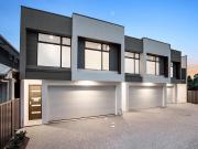A designer townhouse with both cosmopolitan city and...