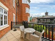 A first floor three bedroom apartment with large wrap...