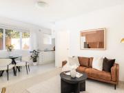 A neat peninsula home with shared parking in prestigious...