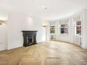 A refurbished top floor Penthouse in this impressive red...