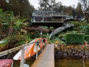 A Riverfront Masterpiece in Location, Design and...