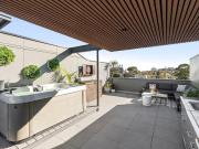 A Rooftop Oasis with Sunset Backdrop
