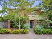 A serene, architectural hideaway with the city in...