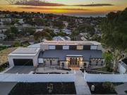 A sophisticated family estate with elite entertaining,...