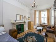 A spacious private room located a short walk from Earls...