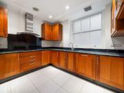 A spacious three bedroom apartment in Mayfair with a 24...