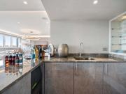 A spectacular duplex penthouse apartment located in...