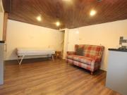 A studio apartment modern appliances and a separat