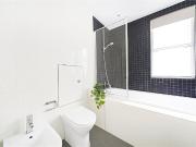 A three bedroom duplex apartment on the ground and lower...