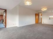 A top floor apartment set within a secure gated...