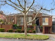 A tranquil oasis in a majestically tree lined locale