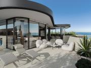 Absolute beachfront living at rare development in iconic...