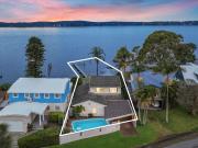 Absolute waterfront home with pool