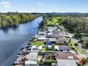 Absolute waterfront opportunity with boat shed and...