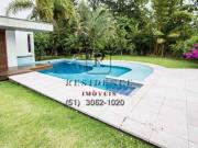 Aluguel de Casa de 453m² com 3 Suítes e 4 Vagas no...