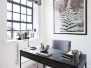 An exclusive penthouse apartment located in a converted...