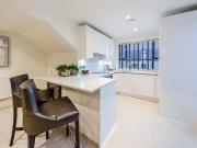 An exclusive penthouse apartment located in a converted...