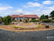 An Idyllic Family Homestead with Abundant Gardens & Grounds