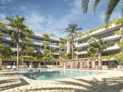 Apartamentos con piscina infinita y jardines en San...
