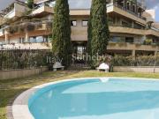 Appartamento con giardino e piscina condominiale