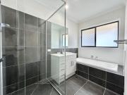 As new 4 bedroom with low maintenance garden