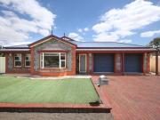 Attractive brick home set on a low maintenance allotment