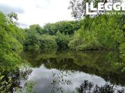 Beau terrain de 11 hectares comprenant un lac de 8 000...