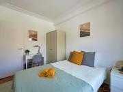 Bedroom in a 6 bedroom apartment in R. do Arco do...