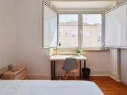 Bedroom in a 7 bedroom apartment in R. David Lopes,...