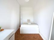 Bedroom in a 7 Bedroom Apartment in Rua Joaquim António...