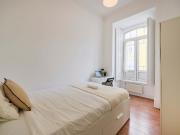 Bedroom in a 9 Bedroom Apartment in Rua Morais Soares,...