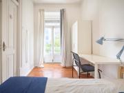 Bedroom with balcony in a 7 bedroom apartment in Lisbon...