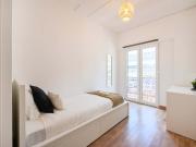 Bedroom with balcony in a 9 Bedroom Apartment in Rua...
