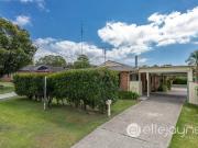 Brick and Tile Home with Ample Shedding and Side Access...