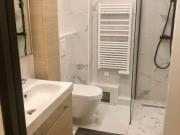 Bright apartment looking out onto the building's...