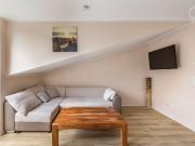 Bright, modern apartment with daylight bathroom and...