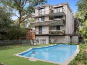 Bright top floor apartment with potential in convenient...