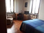 Camera singola con bagno privato e posto auto