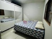 Casa com 2 dormitórios à venda, 125 m² por R$ 318.000...